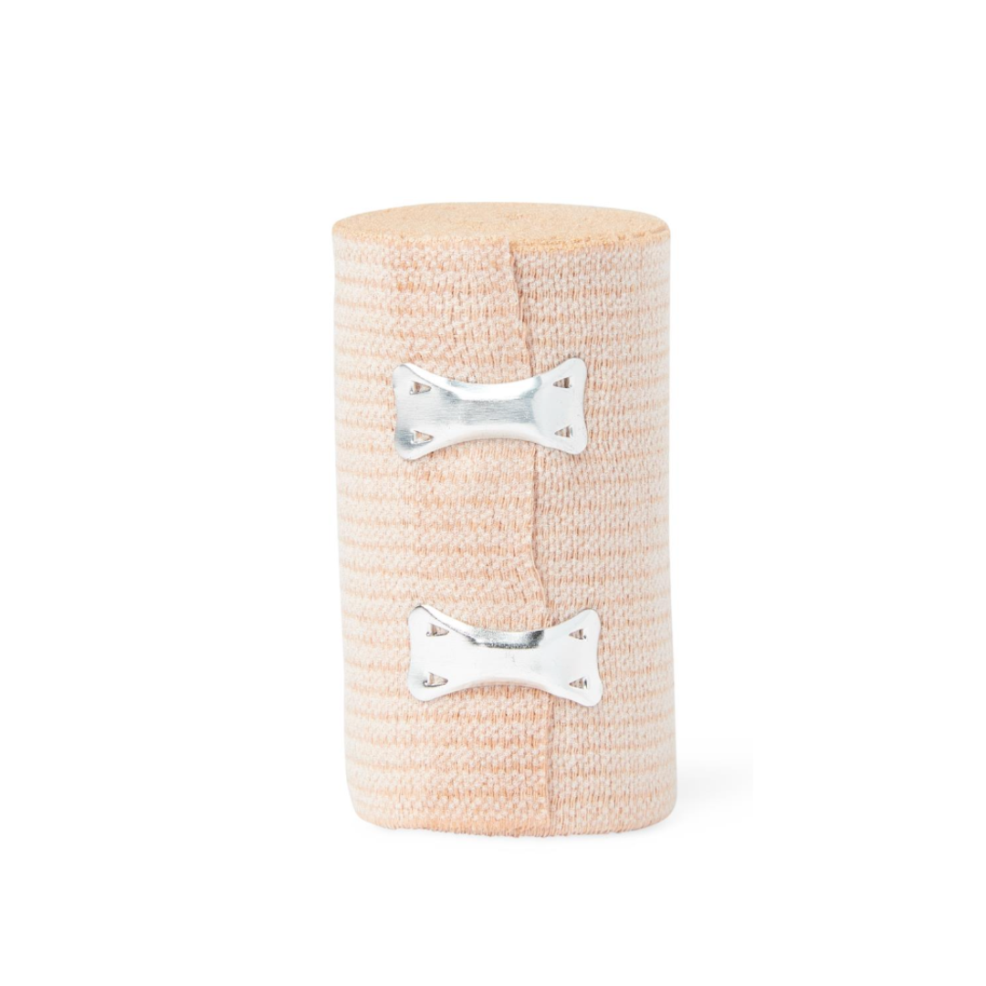A Medline Soft-Wrap Elastic Bandage in beige stands upright against a white background, rolled and secured with two silver metal clips.